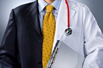 picture of a person from neck to waist dressed in half business attire and half in MD attire